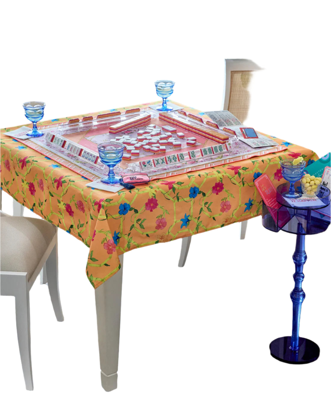 Brighten up your game nights with the vibrant and playful Bagua Blossom Tablecloth. Featuring a stunning mix of orange, pink, yellow, and blue hues, this tablecloth brings a cheerful burst of color to your table. Designed with both style and functionality in mind, it is easy to care for. The Bagua Blossom Tablecloth is the perfect choice to add energy and charm to your mahjong gatherings.

Dimensions: 56”x 56”
100% Polyester
Machine washable. Iron on medium heat