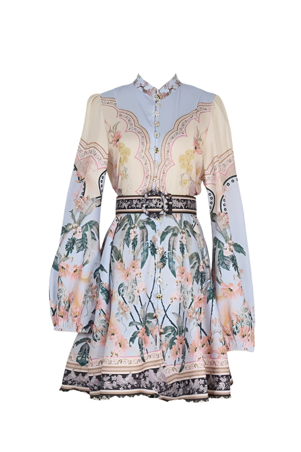 Step into charm with the Maggie Dress in Apricot/Blue. This playful long-sleeve dress features a high collar and a delightful printed pattern, perfect for adding a splash of color and fun to your wardrobe.&nbsp;