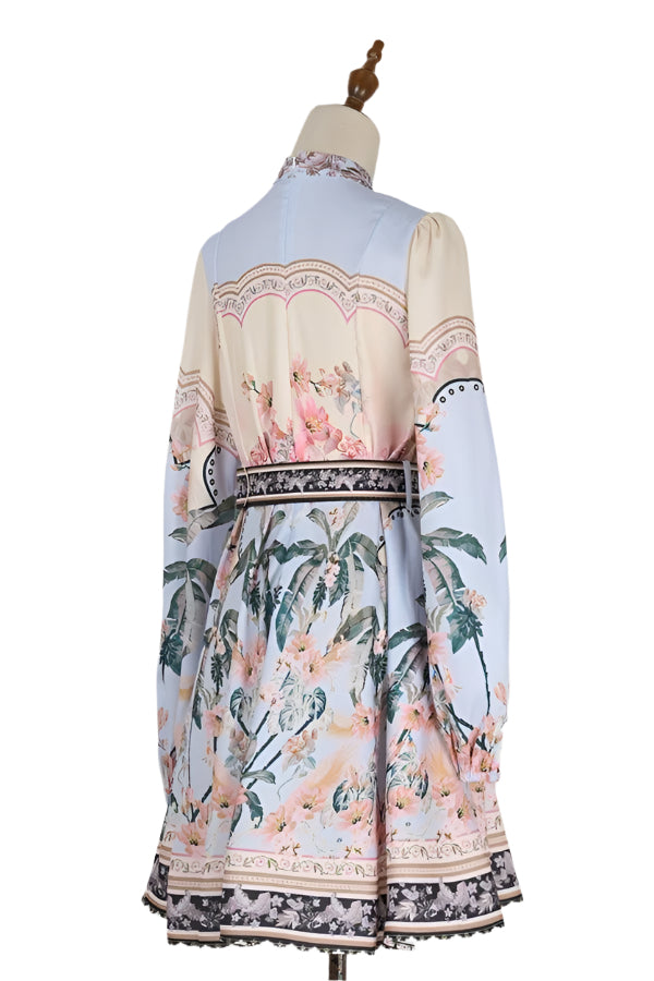 Step into charm with the Maggie Dress in Apricot/Blue. This playful long-sleeve dress features a high collar and a delightful printed pattern, perfect for adding a splash of color and fun to your wardrobe.