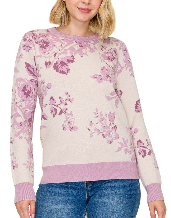 Woman wearing a floral sweater with a plain background
