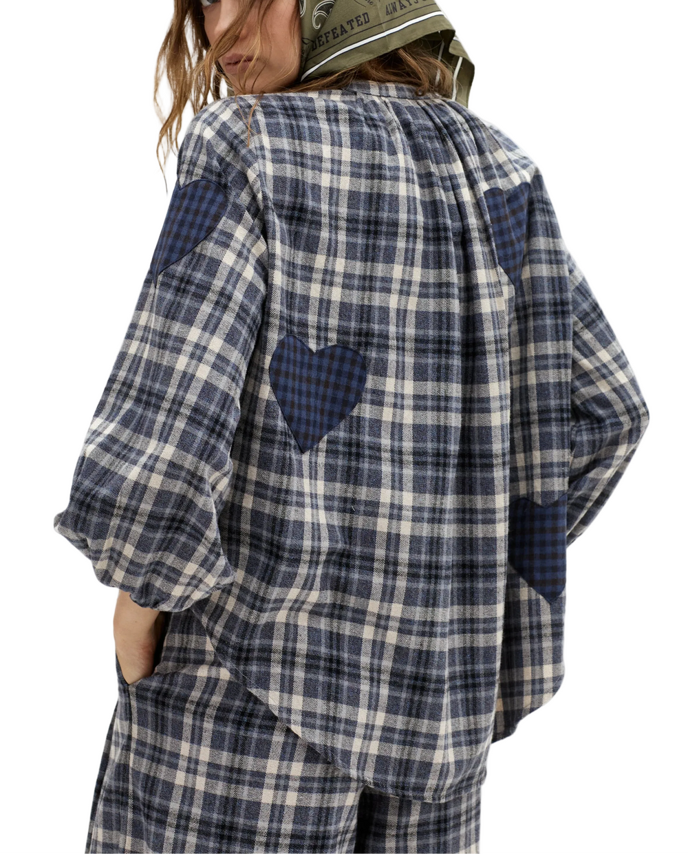 A true house classic. Our romantic Cupid Shirt is back in a beautiful blue-toned check we love. It's crafted from super soft 100% natural cotton twill, with heart appliqués made from a lovely wool twill. This oversized shirt is cheerful and incredibly comfortable, featuring a mandarin collar, mother-of-pearl buttons, and long puffed sleeves with elastic cuffs.