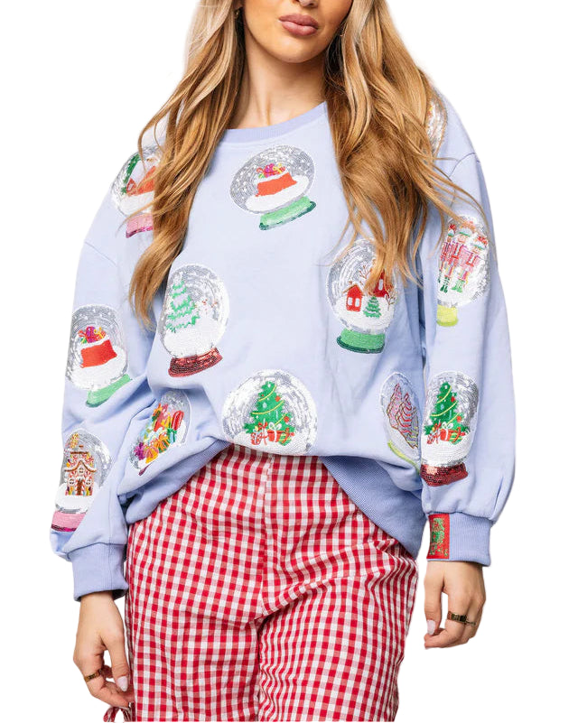 Cozy up in our playful Powder Blue Christmas Snow Globe Sweatshirt, adorned with charming snow globe designs on both front and back. Perfect for keeping warm during chilly winter nights and adding festive cheer throughout the holiday season. Its soft, light blue fabric brings a splash of winter magic to your wardrobe!

