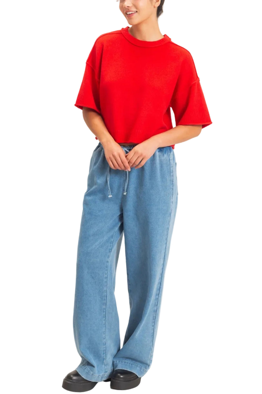 Embrace the relaxed silhouette of this ribbed crew neck pullover top, featuring elbow-length sleeves and a straight hem. With rolled raw-edge sleeves and hem, the versatile cut is ideal for layering over a collared shirt for a chic office ensemble or pairing with high-waisted jeans for a laid-back weekend vibe.