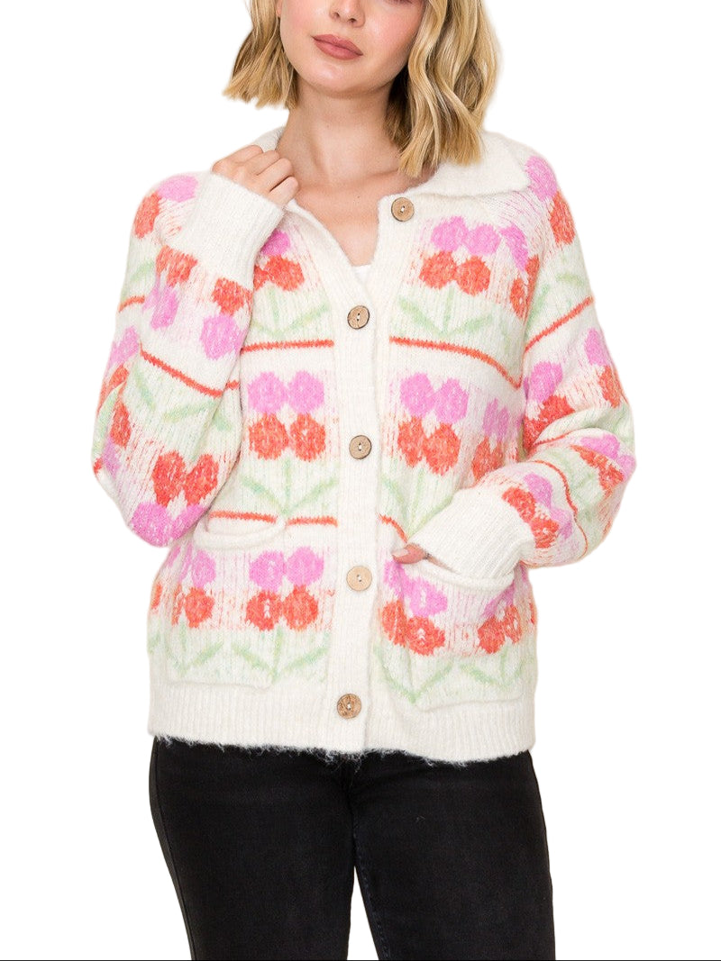 Add a burst of cheerful charm to your wardrobe with the Lauren Flower Cardigan. This playful sweater features a chunky flower jacquard pattern and a cozy collared neckline, blending comfort with fun flair. Perfect for brightening up cool days while keeping you snug and stylish.