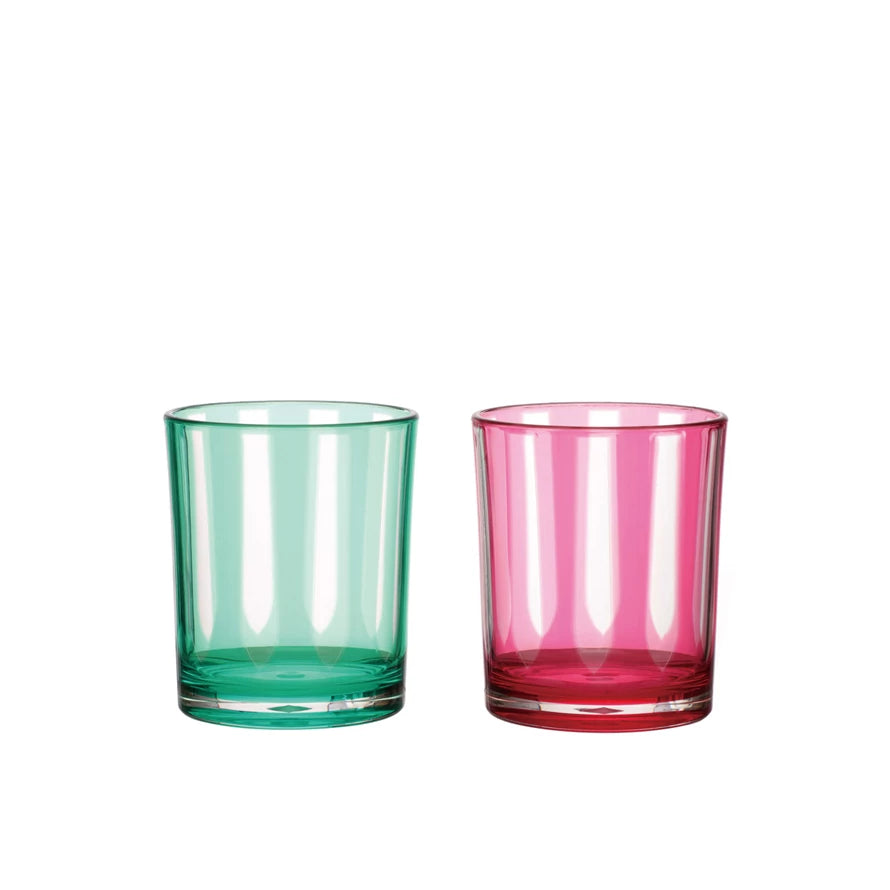 Two colorful glass tumblers, one green and one pink, on a white background.