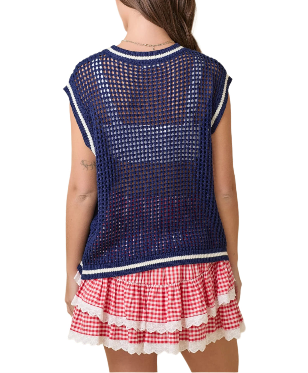 Rock your patriotic pride with our American Flag Crochet Sweater in Navy! This sleeveless sweater boasts a unique design, combining the classic American flag with a trendy crochet pattern.&nbsp;