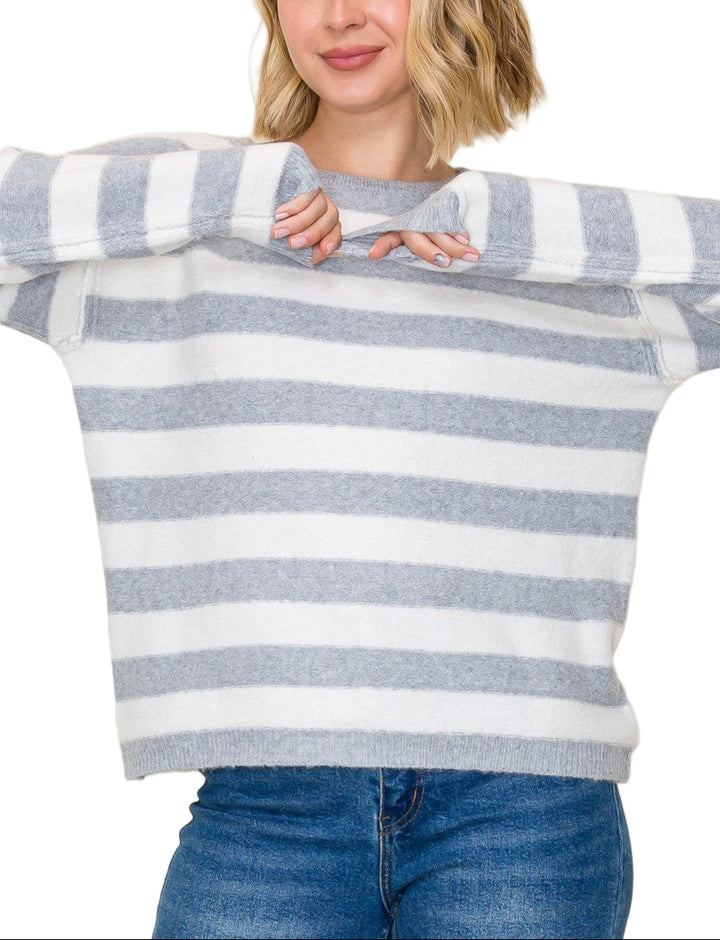 Wrap yourself in cozy charm with the Shannon Striped Crew Neck Sweater. Its playful stripes and classic crew neck make it the perfect pick for brightening up chilly days. Soft and comfortable, this sweater pairs effortlessly with your favorite jeans or skirts for a fun, laid-back look. Get ready to turn heads and stay snug all season long!