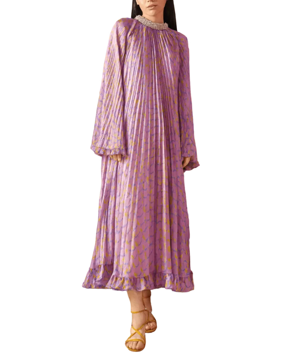 A cosmic swirl of color and movement, the Earth Dress stuns with its pleated silhouette that flows with every step. Crafted from lightweight, airy fabric in a pastel print of lilac, yellow, and turquoise waves, it radiates effortless elegance and can be worn with either side as the front. An embellished collar adds a celestial sparkle, making it perfect for weddings, summer parties, or any moment that calls for a touch of magic. Bold yet graceful, this maxi dress is a statement piece that never goes unnotic