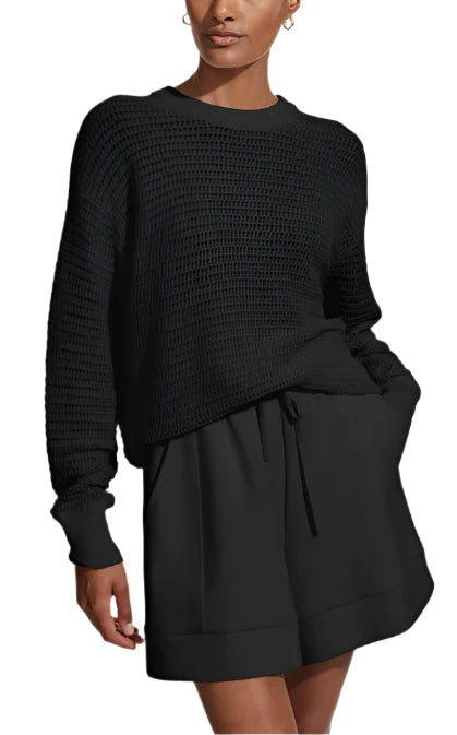 Made in a textured open knit to a relaxed silhouette, this contemporary crewneck style is beautifully light and breathable. Complete with a ribbed hem and cuffs, it can be layered over lifestyle or tennis looks for effortless transitional appeal.