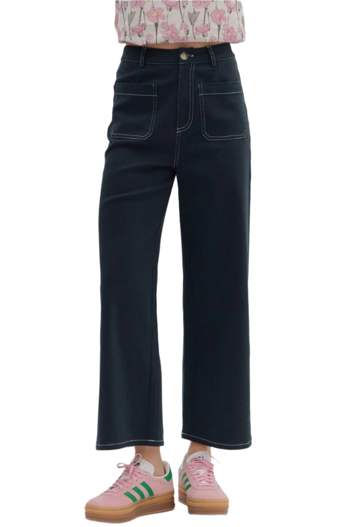Solid high-waist button fly-front zipper closure pants featuring exposed stitch detail. Patch pockets at front and back. Unlined. Woven. Non-sheer. Lightweight.