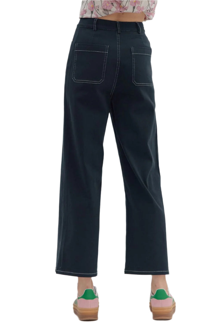 Solid high-waist button fly-front zipper closure pants featuring exposed stitch detail. Patch pockets at front and back. Unlined. Woven. Non-sheer. Lightweight.