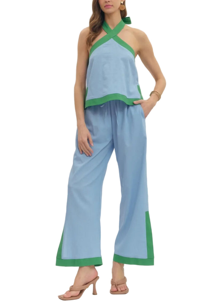 Solid halter sleeveless top featuring contrast binding and matching pants. Unlined. Woven. Non-sheer. Lightweight.