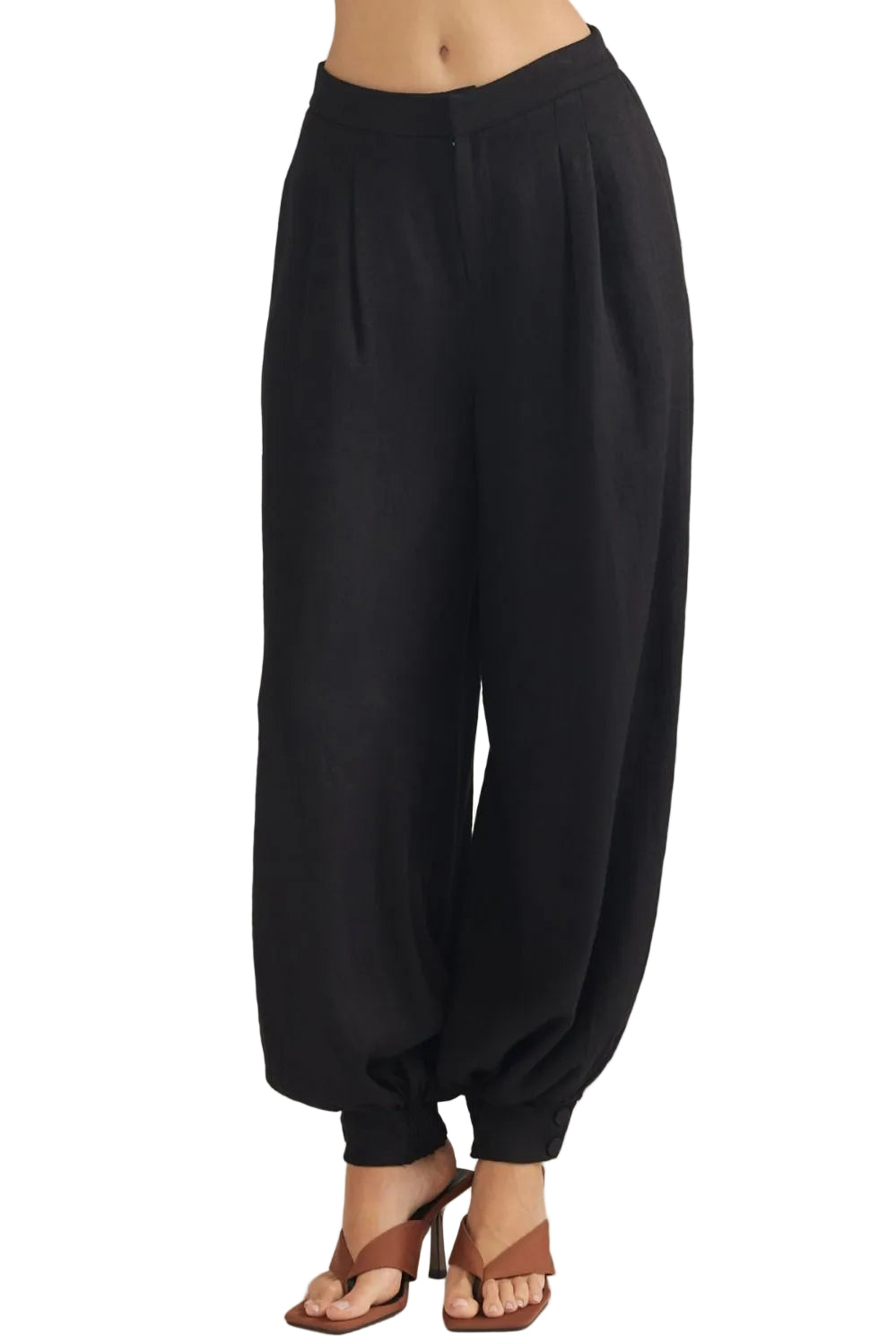 Sally Pants with Buttoned Cuff Hem offer a refined take on everyday wear. The distinctive buttoned cuff detail adds a polished, intentional finish to the hem, elevating the silhouette with subtle sophistication. Crafted for comfort and style, these pants transition seamlessly from casual outings to more put-together occasions. The adjustable cuff allows you to customize the fit and drape to suit your preference. 