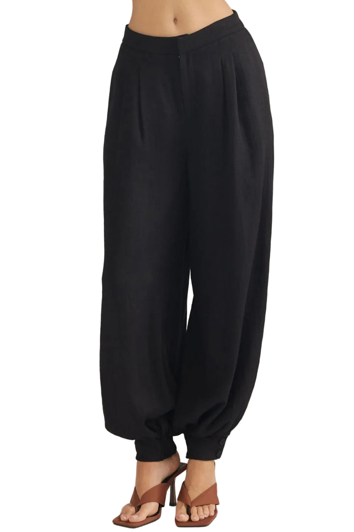 Sally Pants with Buttoned Cuff Hem offer a refined take on everyday wear. The distinctive buttoned cuff detail adds a polished, intentional finish to the hem, elevating the silhouette with subtle sophistication. Crafted for comfort and style, these pants transition seamlessly from casual outings to more put-together occasions. The adjustable cuff allows you to customize the fit and drape to suit your preference. 
