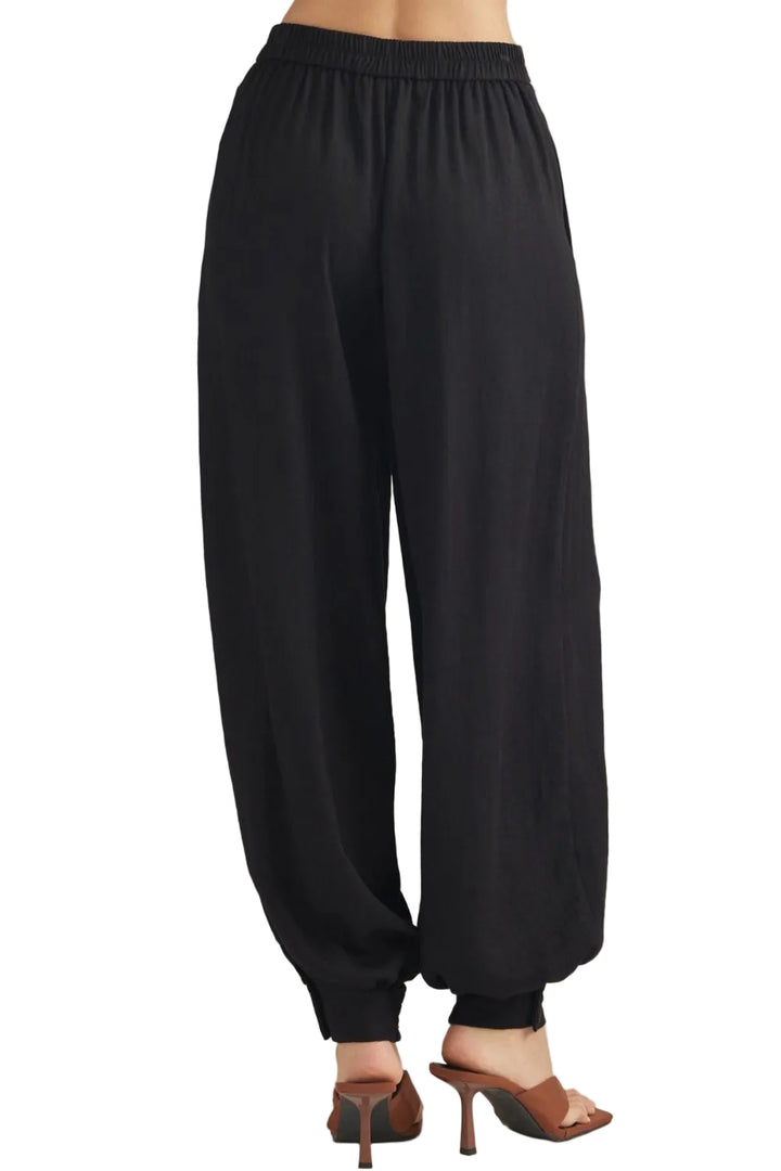 Sally Pants with Buttoned Cuff Hem offer a refined take on everyday wear. The distinctive buttoned cuff detail adds a polished, intentional finish to the hem, elevating the silhouette with subtle sophistication. Crafted for comfort and style, these pants transition seamlessly from casual outings to more put-together occasions. The adjustable cuff allows you to customize the fit and drape to suit your preference. 