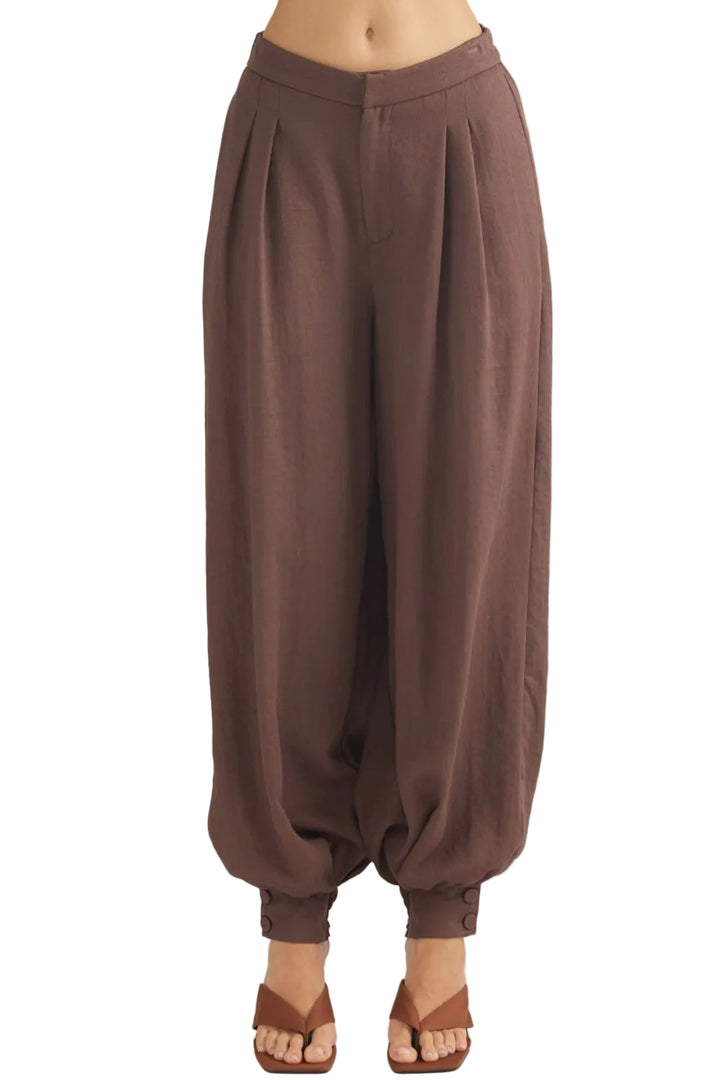 Sally Pants with Buttoned Cuff Hem offer a refined take on everyday wear. The distinctive buttoned cuff detail adds a polished, intentional finish to the hem, elevating the silhouette with subtle sophistication. Crafted for comfort and style, these pants transition seamlessly from casual outings to more put-together occasions. The adjustable cuff allows you to customize the fit and drape to suit your preference. 