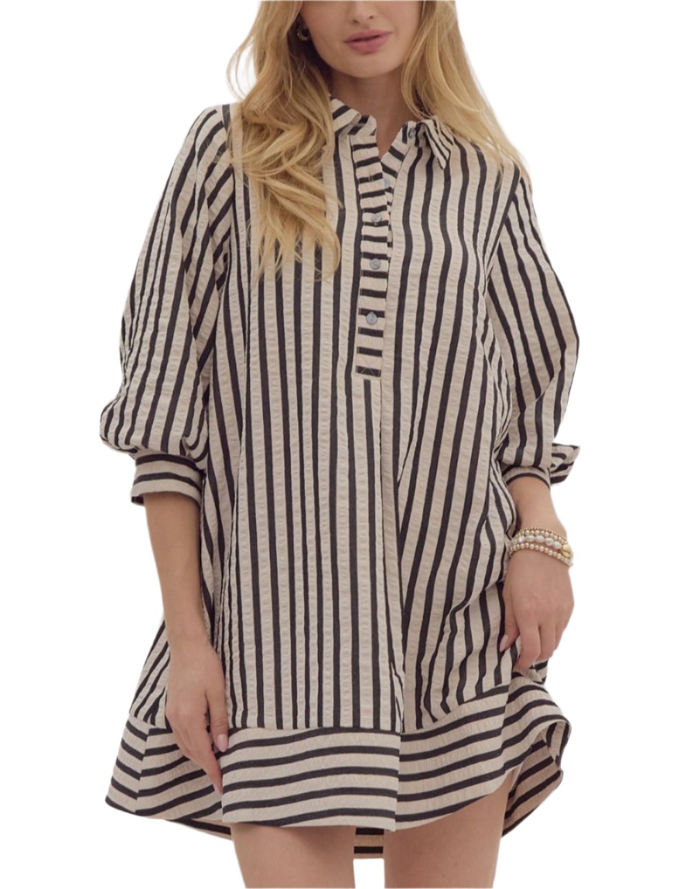 Striped seersucker pullover mini dress featuring button closure cuff 3/4 bubble sleeve. Collared half button front closure. Pockets at side. Lined. Woven. Non-sheer. Lightweight.