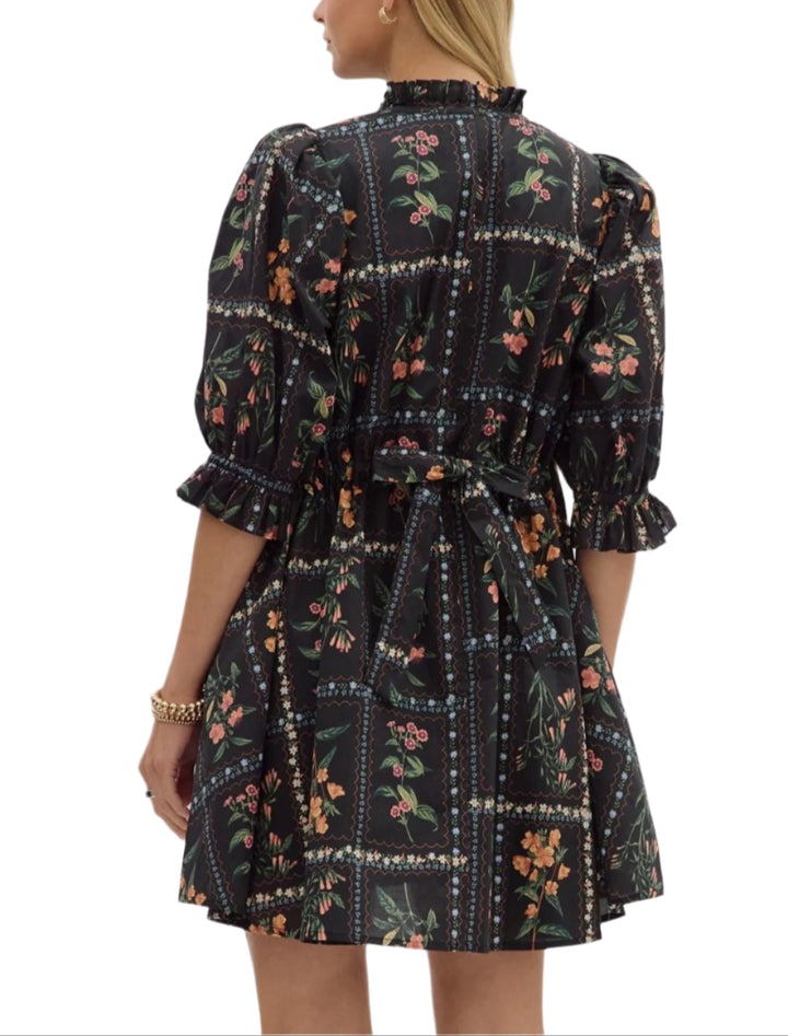 Solid pleated shoulder puff sleeve ruffle hem mini dress. Ruffle band collar button closure at front. Side pockets. Lined. Woven. Non-sheer. Lightweight.
