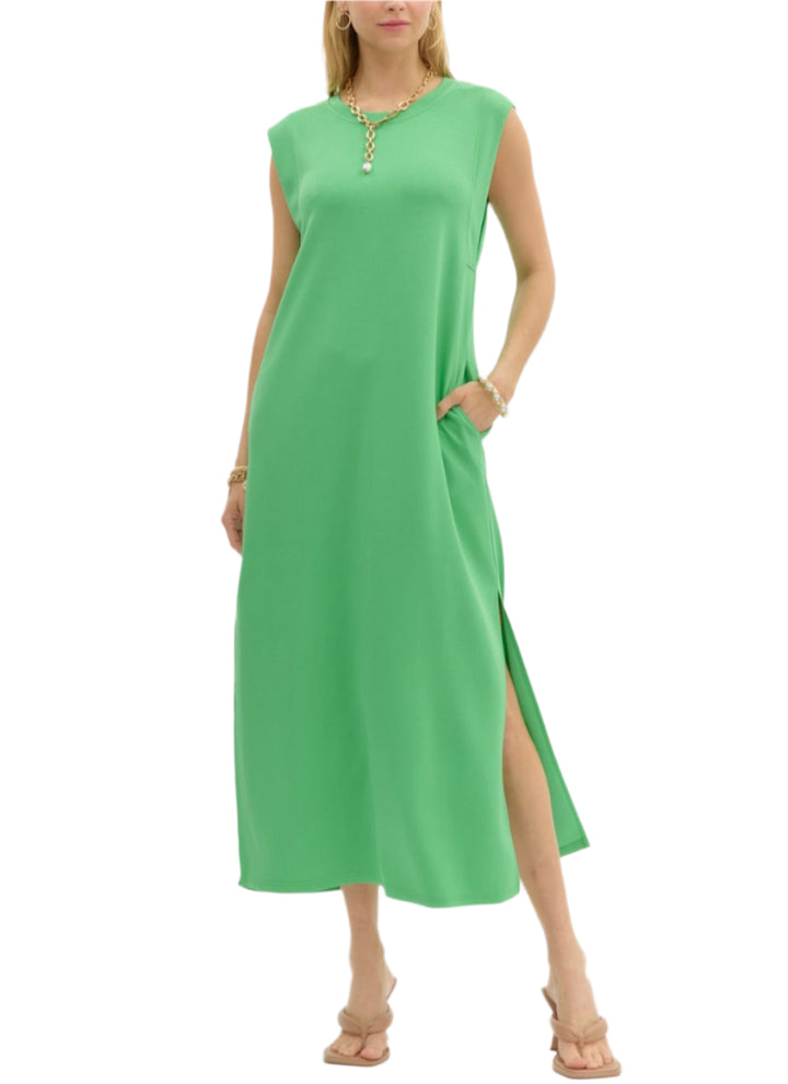 Solid jersey knit pullover midi dress featuring side slit hem. Pockets at sides. Unlined. Knit. Non-sheer. Lightweight.