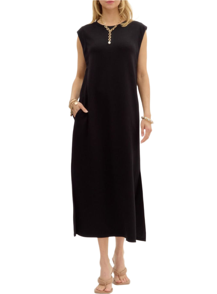Solid jersey knit pullover midi dress featuring side slit hem. Pockets at sides. Unlined. Knit. Non-sheer. Lightweight.
