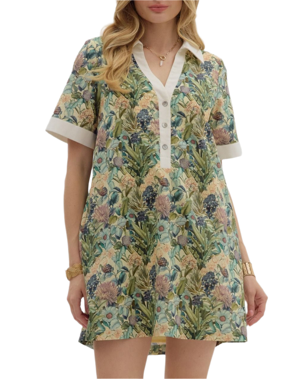 Floral print short sleeve mini dress featuring contrast accent collar button closure and band detail. Pockets at sides. Lined. Woven. Non-sheer. Lightweight.