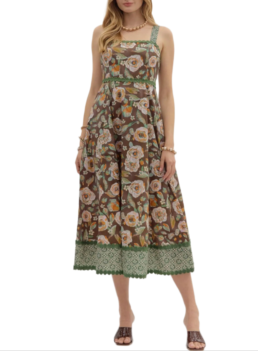 Floral print adjustable shoulder strap empire midi dress featuring contrast accent print and trim finish. Zipper and smocked closure at back. Pockets at sides. Lined. Woven. Non-sheer. Lightweight.