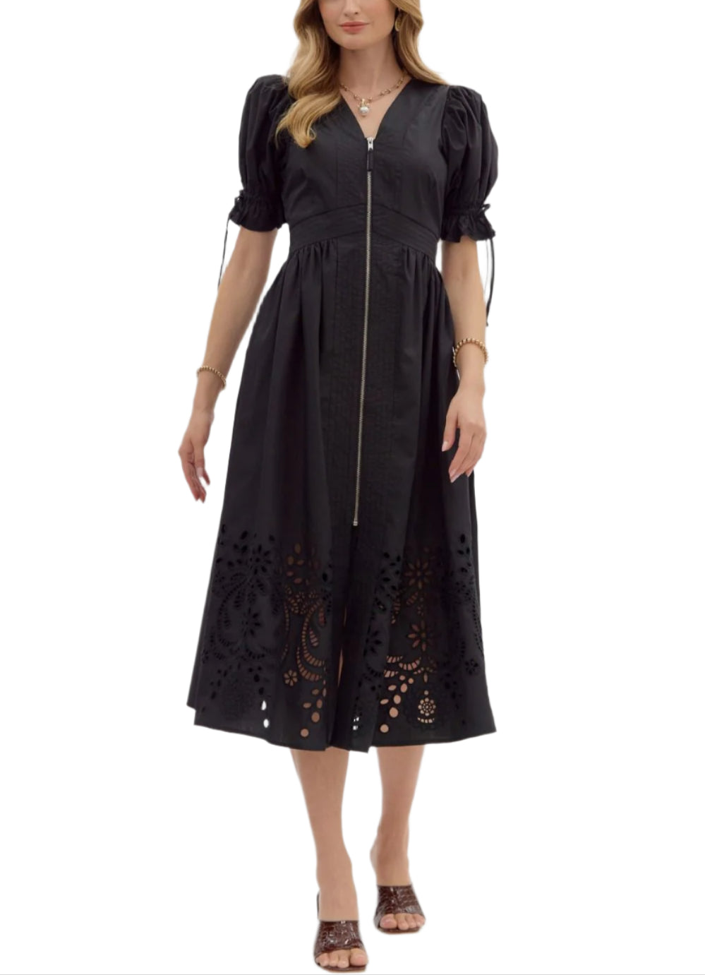 Solid short puff sleeve midi dress featuring stitch accent V-neck and waistband and embroidered skirt hem. Zipper front closure with smocked waistband at back. Lined. Woven. Non-sheer. Lightweight.