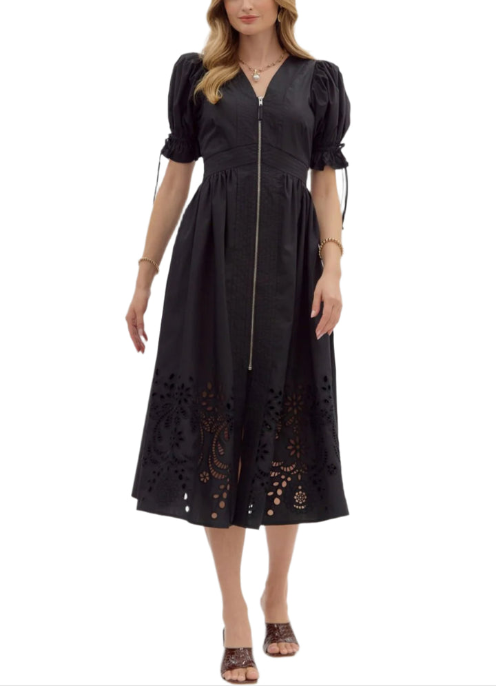 Solid short puff sleeve midi dress featuring stitch accent V-neck and waistband and embroidered skirt hem. Zipper front closure with smocked waistband at back. Lined. Woven. Non-sheer. Lightweight.