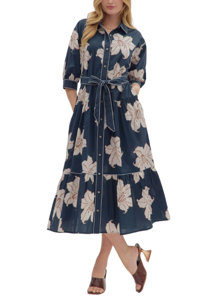 Floral print 3/4 sleeve midi dress featuring button closure at front and detachable waist tie belt. Side pockets. Lined. Woven. Non-sheer. Lightweight.
