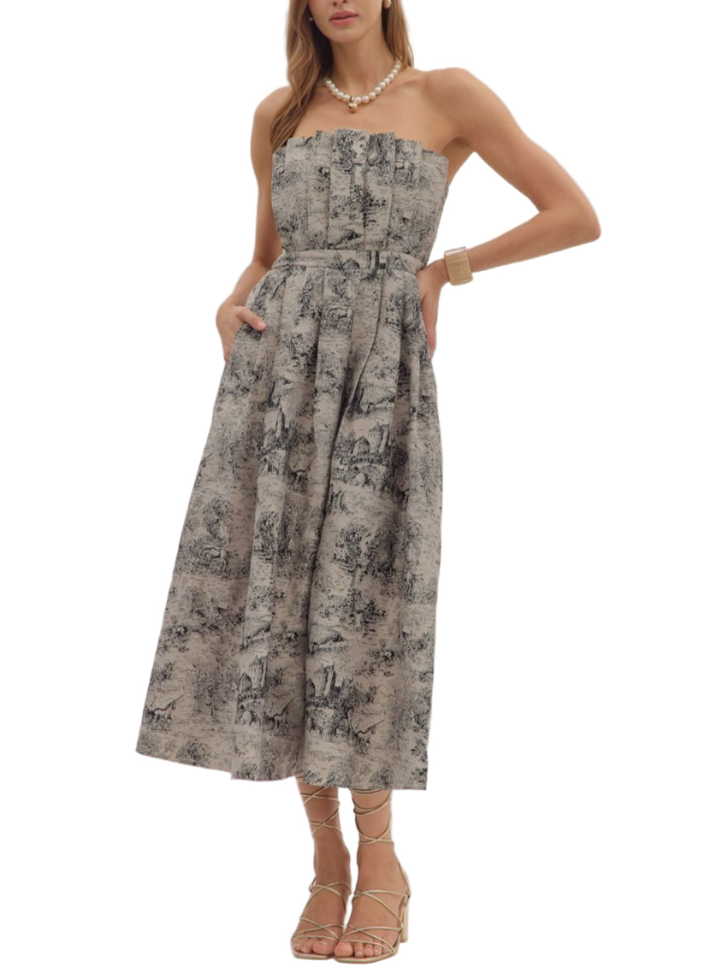 Printed strapless midi dress featuring ruffled straight neckline and pleated skirt. Zip closure at back. Smocked back panel. Side pockets. Unlined. Woven. Non-sheer.
