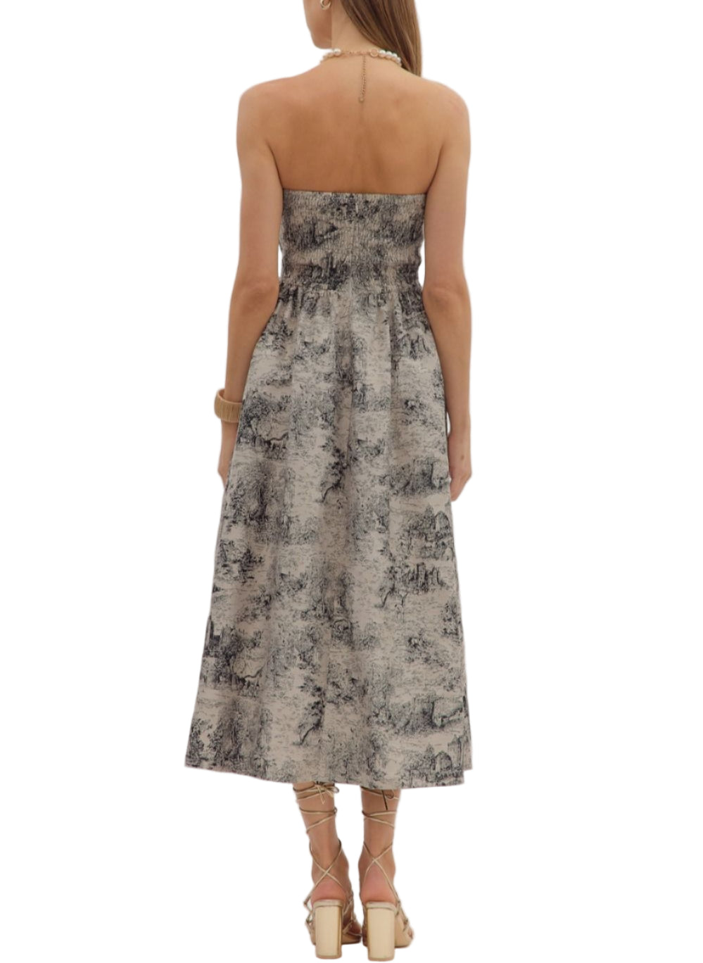 Printed strapless midi dress featuring ruffled straight neckline and pleated skirt. Zip closure at back. Smocked back panel. Side pockets. Unlined. Woven. Non-sheer.
