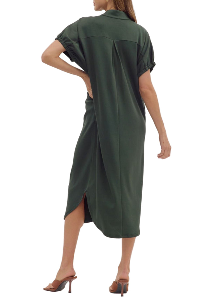 Solid short sleeve midi dress featuring band collar V-neck and elasticated sleeve openings. Side pockets. Unlined. Knit. Non-sheer. Lightweight.

