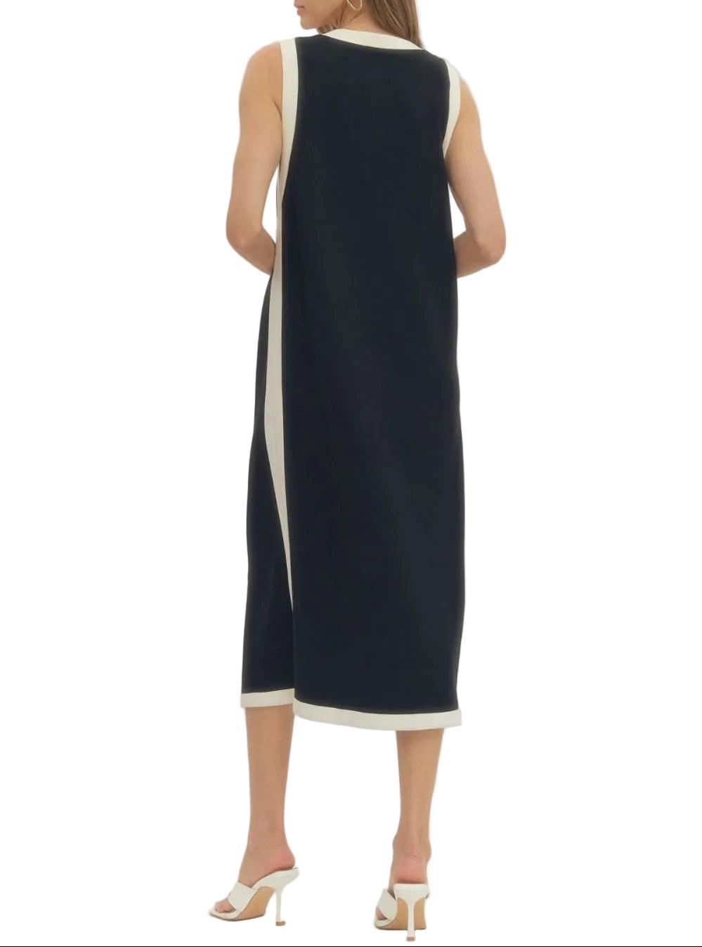 Solid sleeveless midi dress featuring contrast binding along neckline, armholes, and hem. Side slit at hem. Unlined. Knit. Non-sheer. Lightweight.
