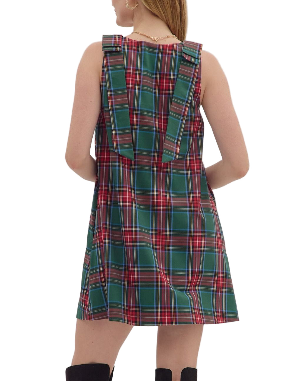 Plaid sleeveless mini dress featuring bow detail at straps. Side pockets. Lined. Woven. Non-sheer. Lightweight.