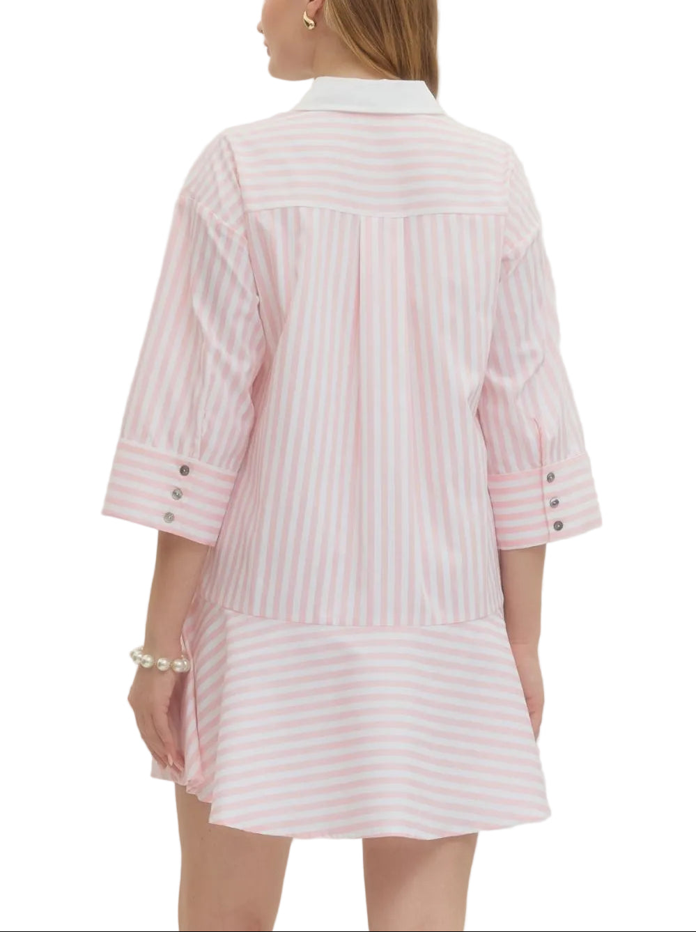 Playful stripes meet effortless style in this charming mini dress. The classic striped pattern brings a timeless appeal, while tailored sleeve cuffs add a polished finishing touch. Perfect for casual outings or dressed-up occasions, this versatile piece transitions seamlessly from day to night. Comfortable, chic, and endlessly wearable—your new go-to dress awaits.