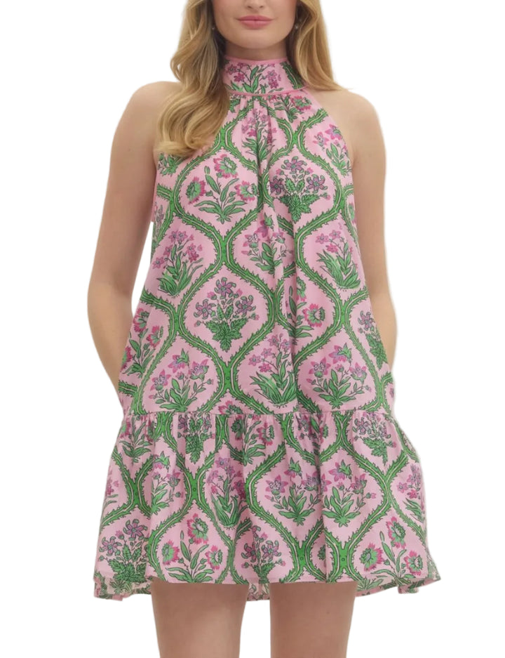 Botanical print sleeveless mini dress featuring halter neckline with self-tie bow at back. Ruffle hem. Side pockets. Lined. Woven. Non-sheer. Lightweight.

