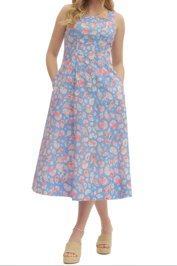 Shell print sleeveless midi dress featuring back zipper closure. Side pockets. Lined. Woven. Non-sheer. Lightweight.