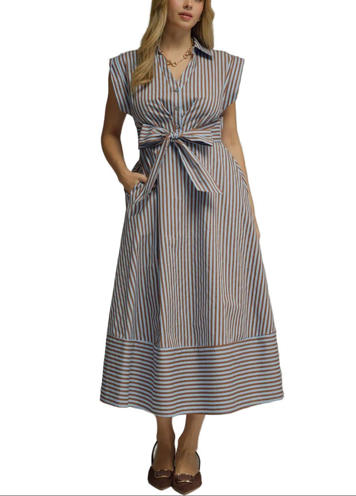 The Meg Striped Midi Dress combines timeless style with everyday versatility. Featuring classic stripes and flattering cap sleeves, this midi-length dress transitions seamlessly from casual outings to weekend gatherings. The relaxed fit and midi silhouette offer comfortable all-day wear, while the striped pattern adds visual interest to your wardrobe. Perfect for layering with a cardigan or jacket, this dress is a wardrobe essential that works across seasons.