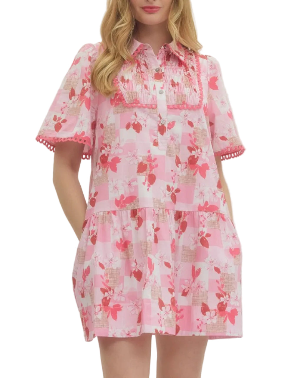 Solid floral short sleeve mini dress featuring pleated bib panel with scallop accent trim. Button closure at front. Side pockets. Unlined. Woven. Non-sheer. Lightweight.
