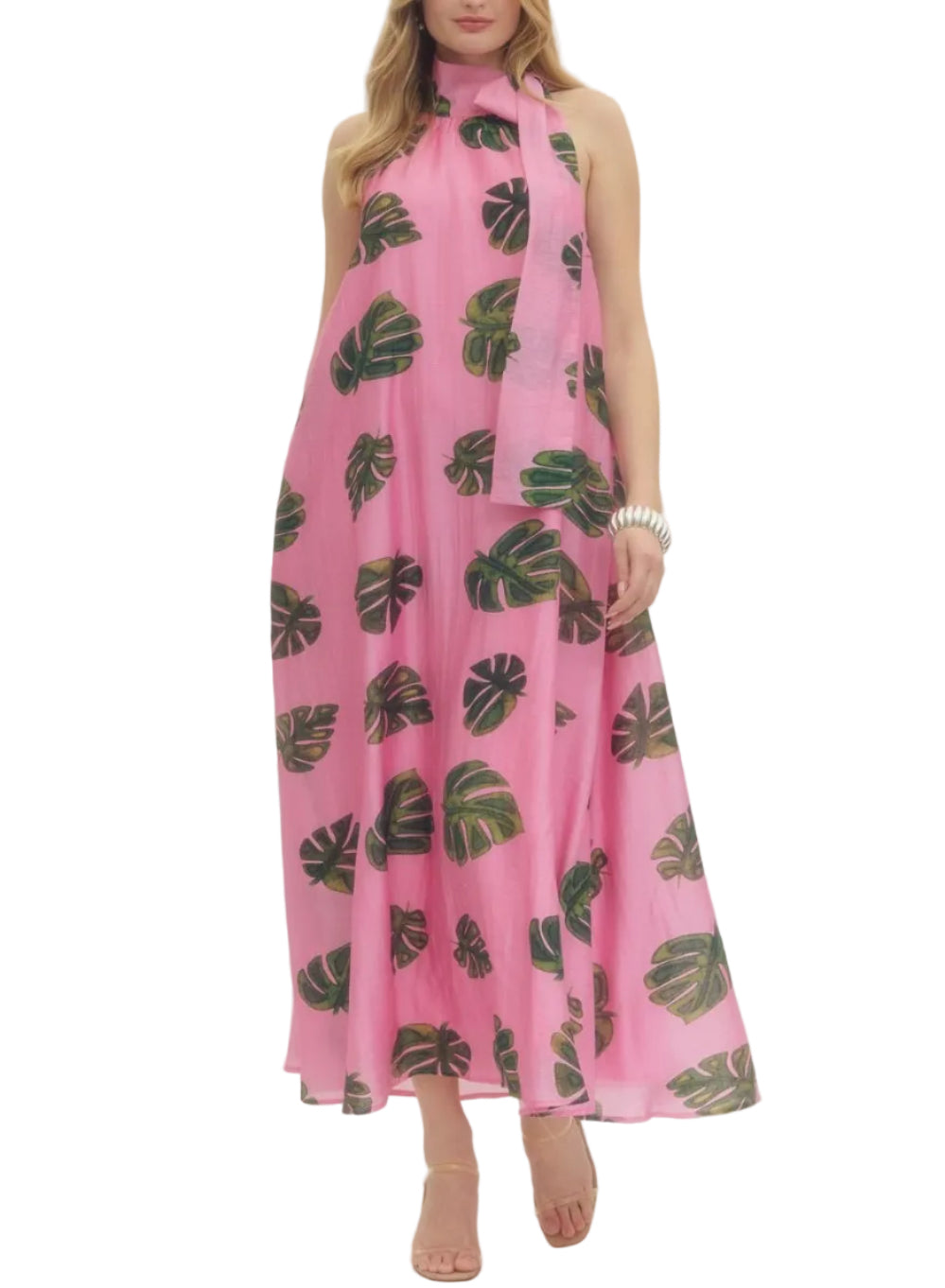Leaf print halter neck maxi dress featuring self-tie detail at neck. Side pockets. Lined. Woven. Non-sheer. Lightweight.
