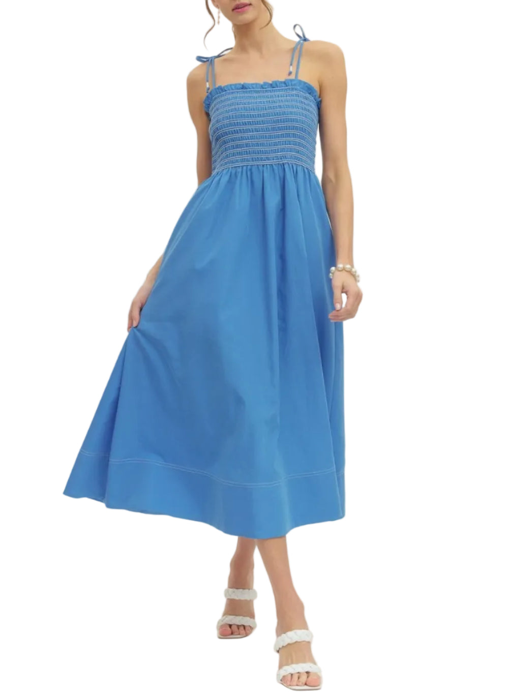 Solid sleeveless midi dress featuring smocked bodice. Tie shoulder straps. Side pockets. Lined. Woven. Non-sheer. Lightweight.
