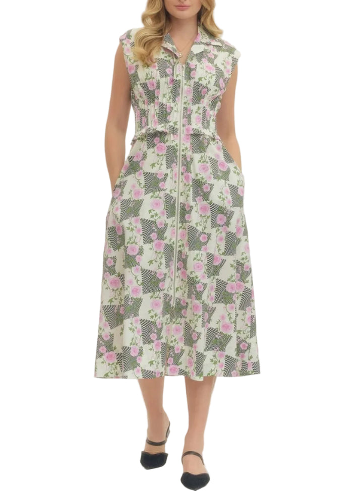 Floral print sleeveless midi dress featuring front zip closure and ruched waist detail. Side pockets. Lined. Woven. Non-sheer. Lightweight.