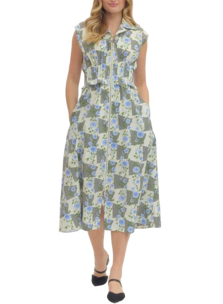 Floral print sleeveless midi dress featuring front zip closure and ruched waist detail. Side pockets. Lined. Woven. Non-sheer. Lightweight.