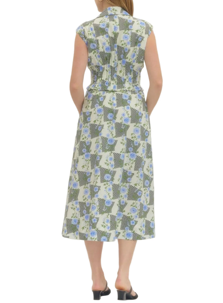 Floral print sleeveless midi dress featuring front zip closure and ruched waist detail. Side pockets. Lined. Woven. Non-sheer. Lightweight.