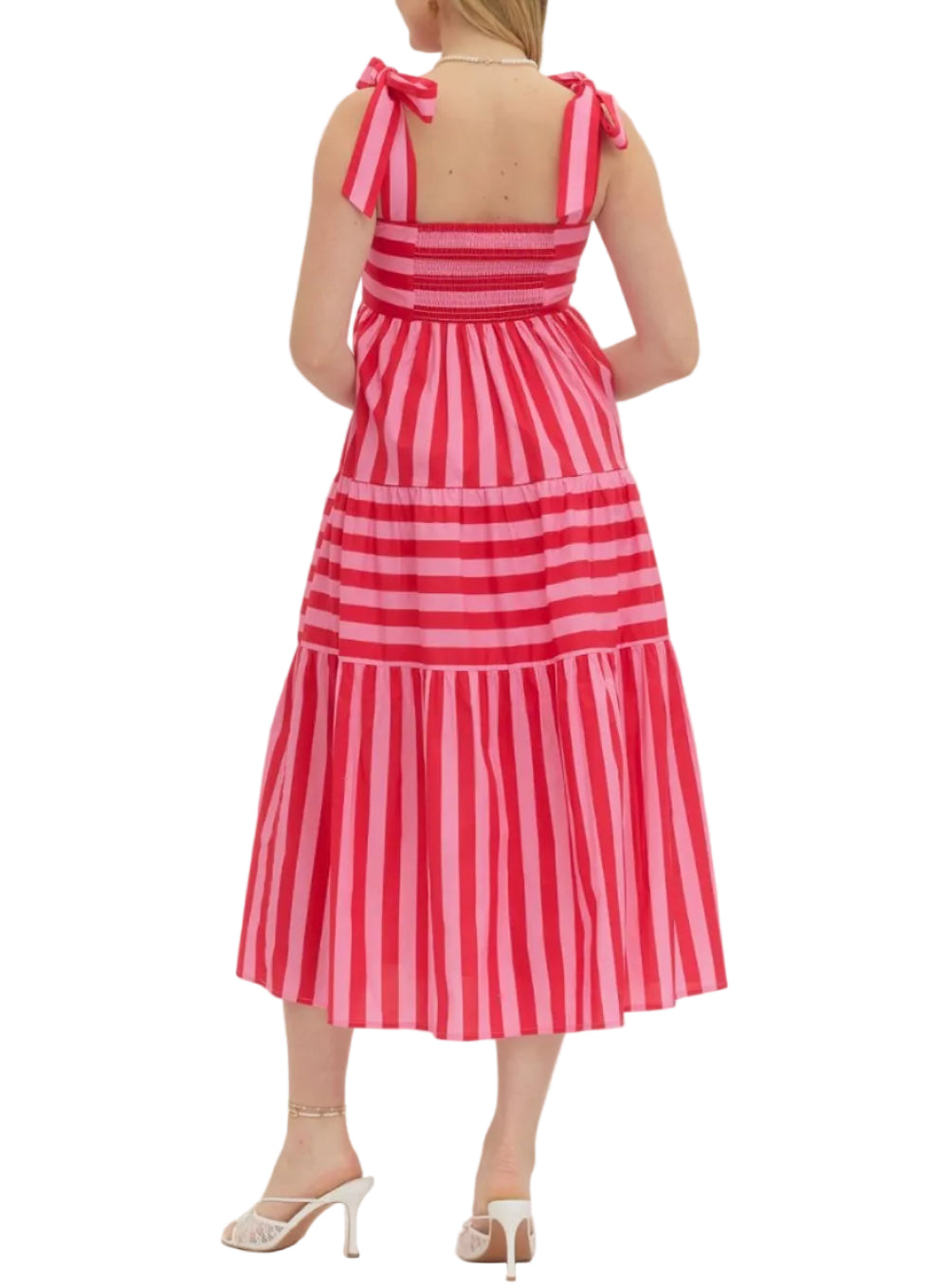 Striped sleeveless midi dress featuring bow shoulder straps. Smocked back bodice. Side pockets. Lined. Woven. Non-sheer. Lightweight.
