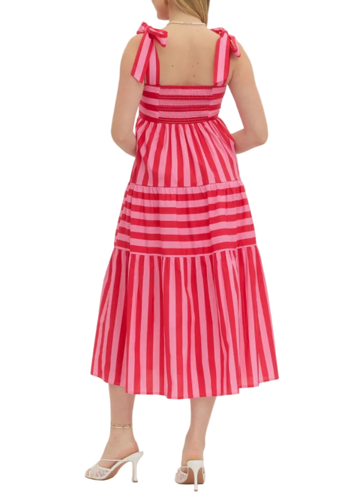 Striped sleeveless midi dress featuring bow shoulder straps. Smocked back bodice. Side pockets. Lined. Woven. Non-sheer. Lightweight.
