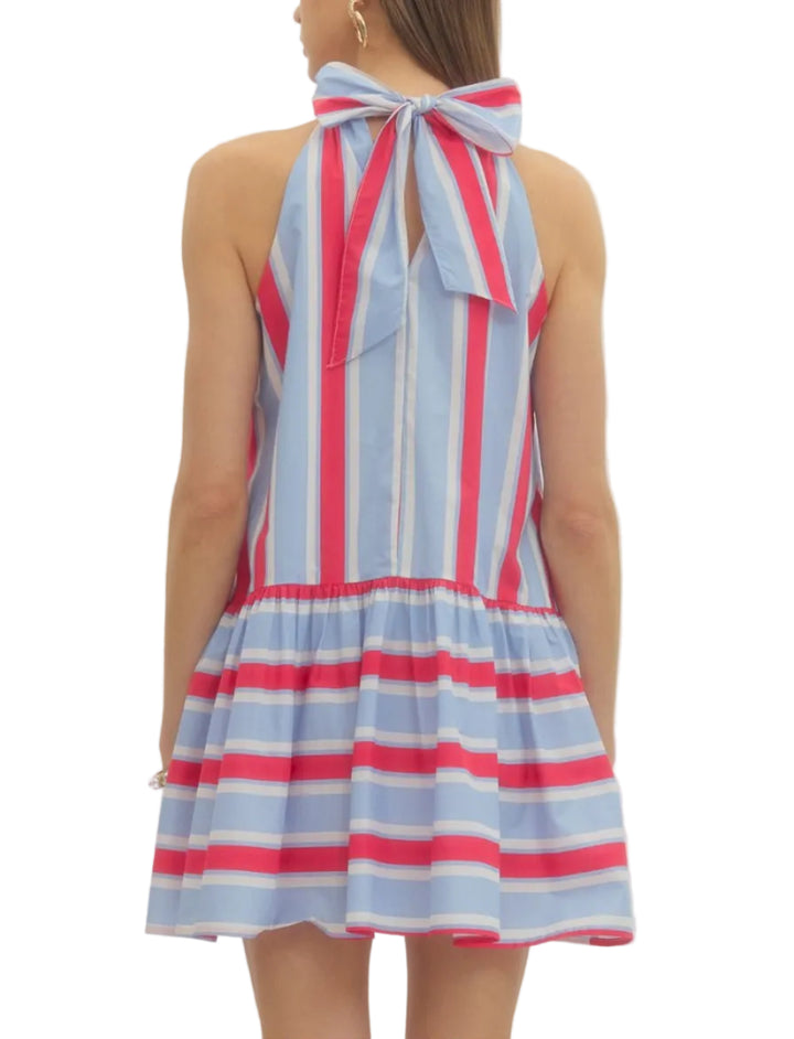 Striped sleeveless mini dress featuring back neck tie. Side pockets. Lined. Woven. Non-sheer. Lightweight.
