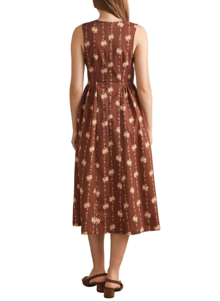 Floral print sleeveless midi dress featuring gathered waist detail. Back zipper closure. Side pockets. Unlined. Woven. Non-sheer. Lightweight.