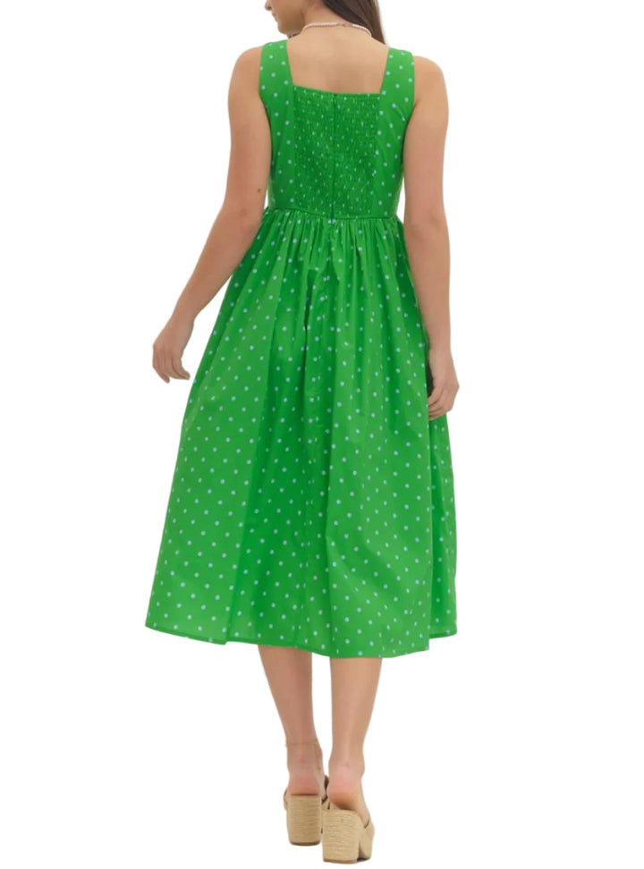 Polka dot sleeveless midi dress featuring square neckline. Back zipper closure. Smocked detail at back bodice. Pocket at side. Lined. Woven. Non-sheer. Lightweight.
