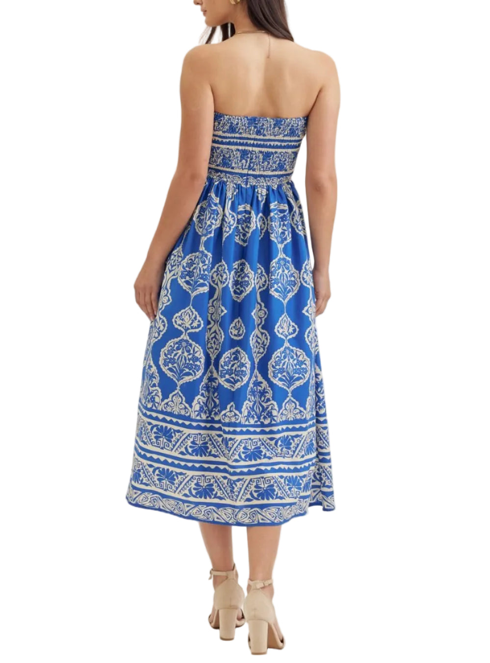 Printed strapless midi dress featuring smocked back bodice. Side pockets. Back zipper closure. Lined. Woven. Non-sheer. Lightweight.